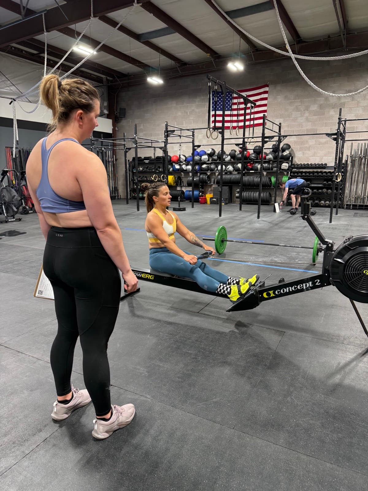 A coach watching a member work at CrossFit Albuquerque