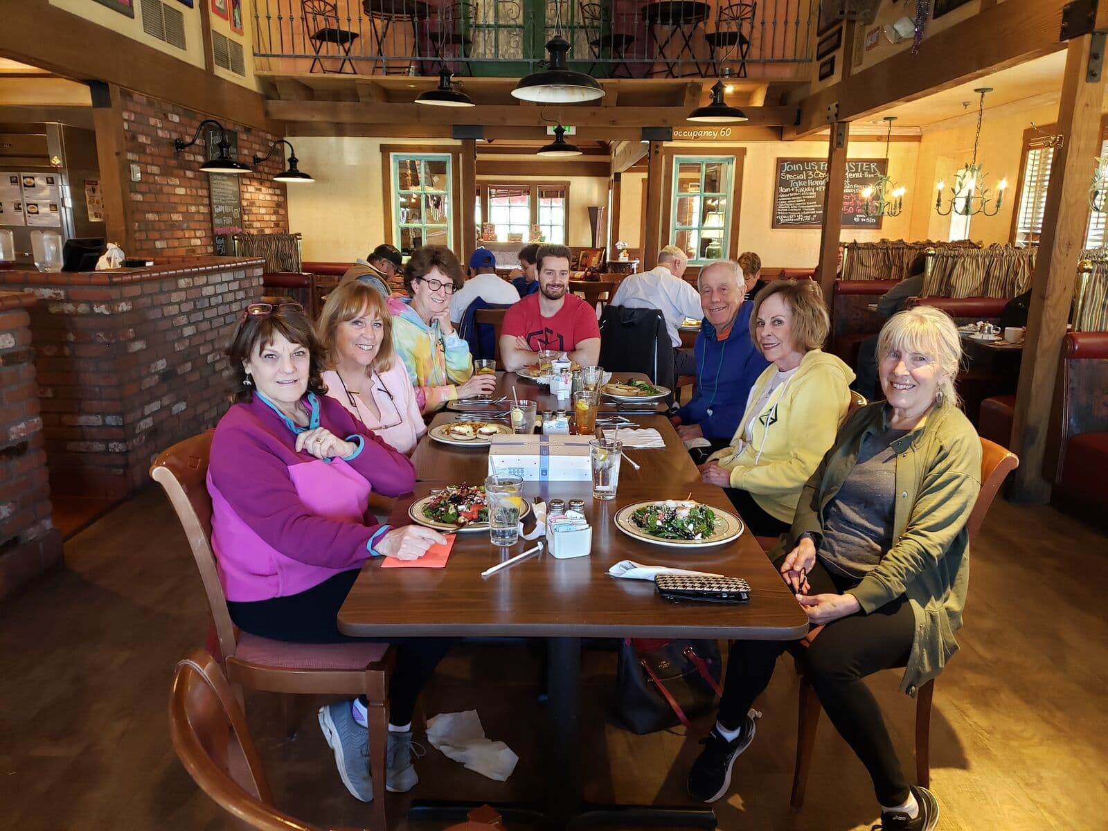 Fit for Life members at a long lunch table