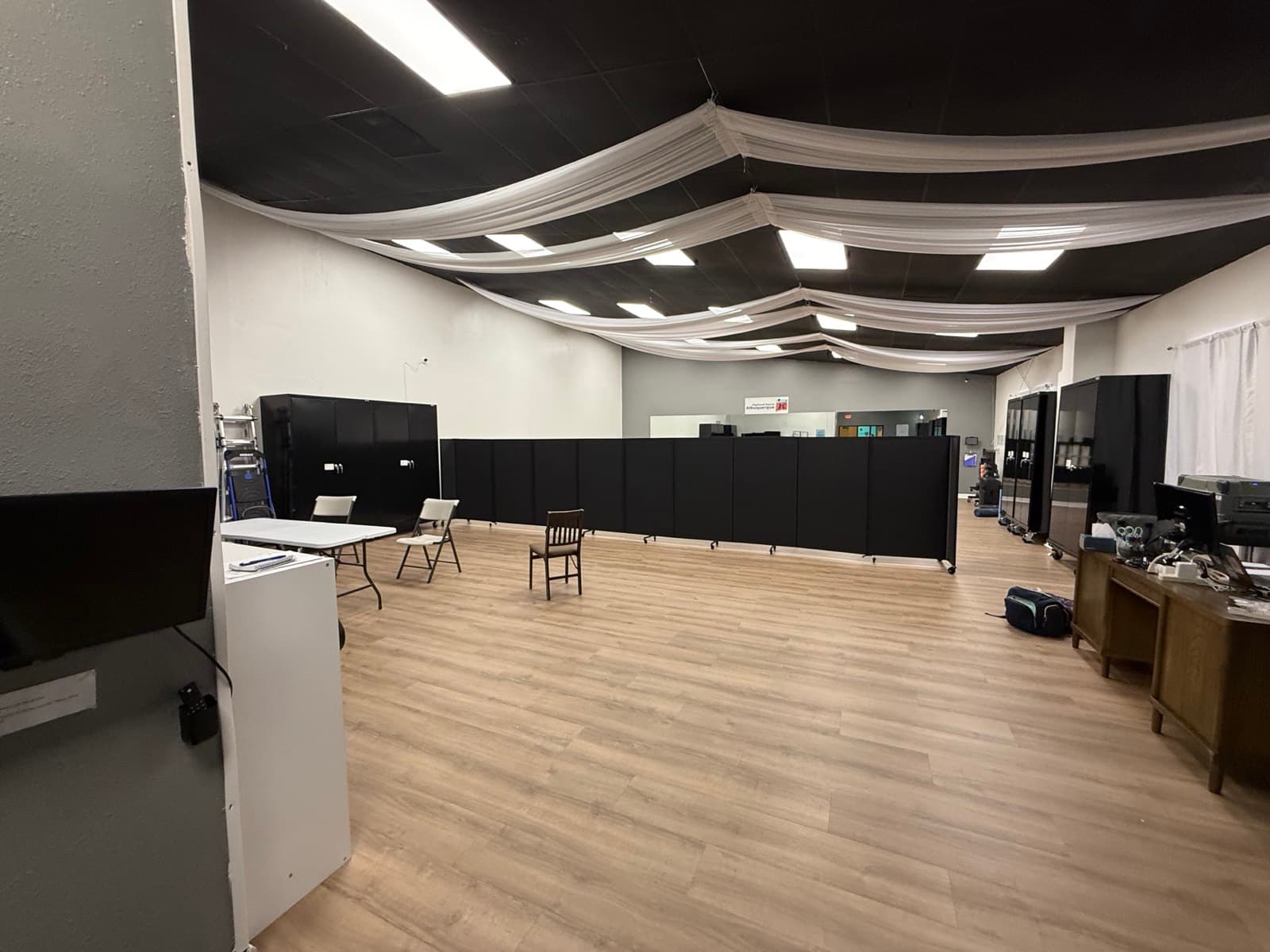 The event room set up with tables along one side